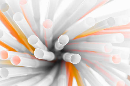 Colored plastic drinking straws on a white backgroundの写真素材