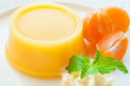orange pudding with fresh creamの写真素材
