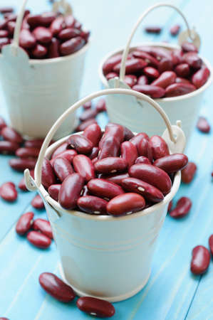 Kidney beans in white bucket on wooden board healthy foodの写真素材