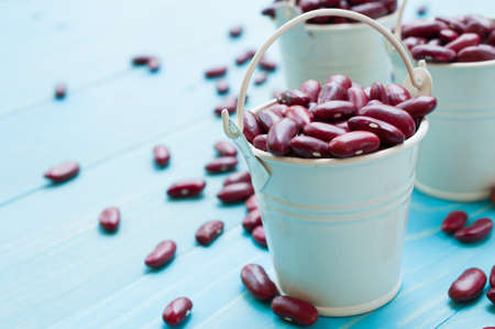 Kidney beans in white bucket on wooden board healthy foodの写真素材