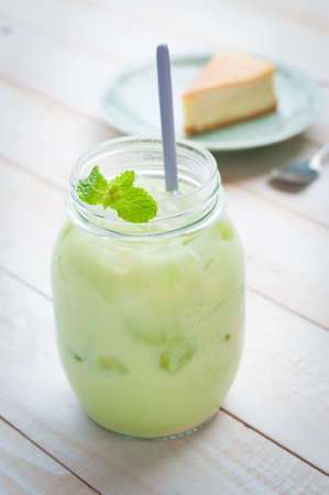 Ice Green tea on white wooden boardの写真素材
