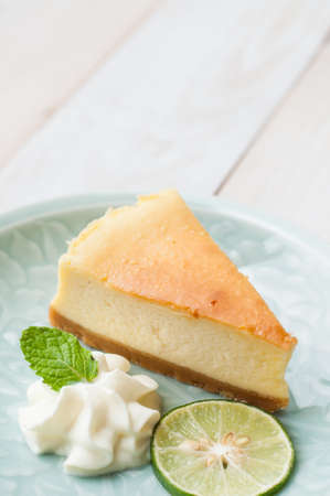 New york cheesecake on white wooden boardの写真素材
