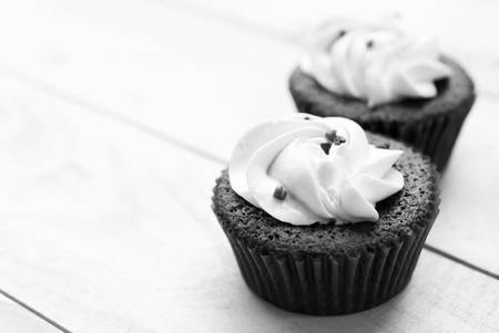 Red velvet cupcake closeup. Filtered to look like an aged instant photo, black and white photoの写真素材