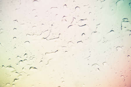 Drops of rain on blue glass drops on glass after rainの写真素材