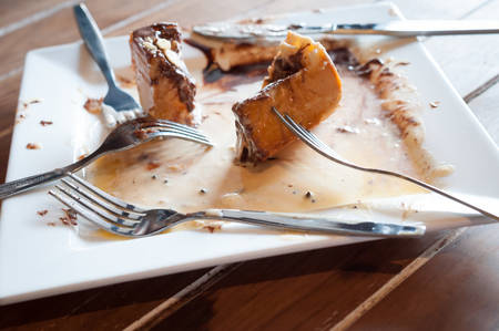 An empty plate dirty after the meal is finished.の写真素材