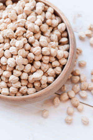 chick-pea on white wooden backgroundの写真素材