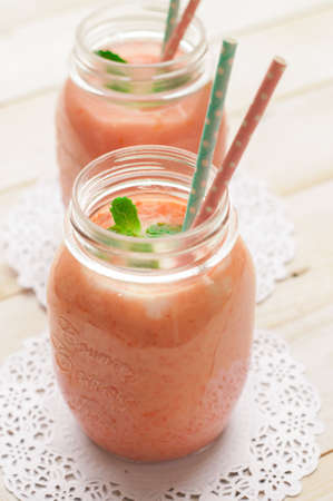 Strawberry carrot Smoothie on a backgroundの写真素材