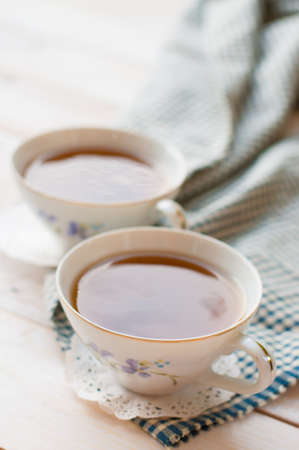 Afternoon tea on white wooden baoedの写真素材