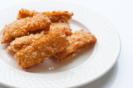 Fried fish nuggets on white backgroundの写真素材
