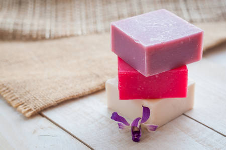 natural soap on bright wooden background