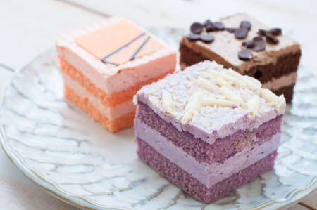 different pieces of cake. Isolated on white backgroundの写真素材