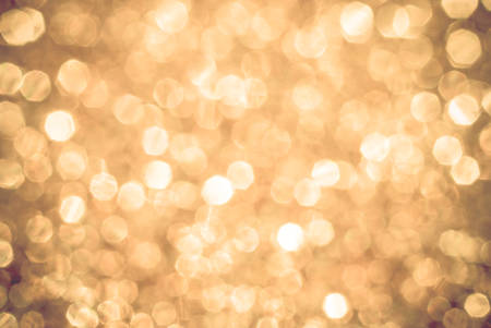 yellow white boken background lights, blurred out of focus, shiny glittery lights or circle shapes, Christmas backgroundの写真素材