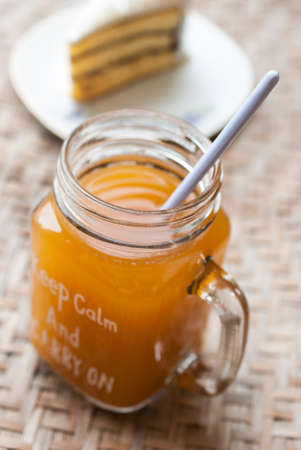 ice tea in mason jar with cake, thai teaの写真素材