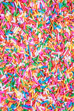 Sugar sprinkle dots, decoration for cake and bekery, a lot of sprinkles as a backgroundの写真素材