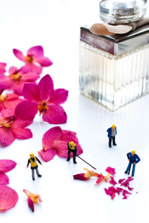 alchemy and aromatherapy set with orchid flowers and miniature peopleの写真素材