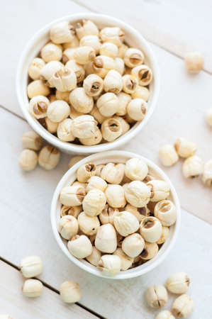 Dried lotus seeds on white backgroundの写真素材