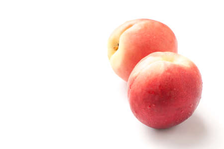 Ripe peach fruit isolated on white backgroundの写真素材