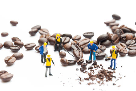 coffee beans with miniature peopleの写真素材
