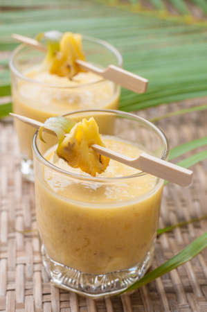 pineapple smoothie,Healthy drink smoothies leaf on wooden board