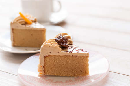 Coffee cake on white wooden boardの写真素材