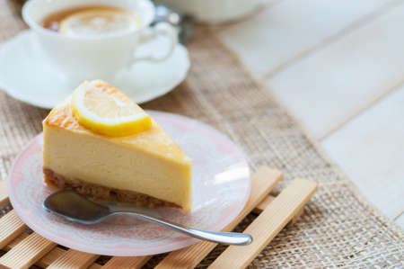 A slice of lemon cheesecake.の写真素材