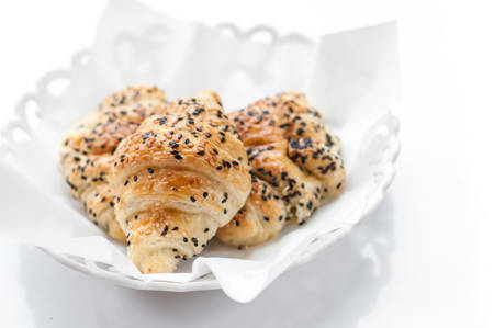 Fresh baked croissants on white backgroundの写真素材