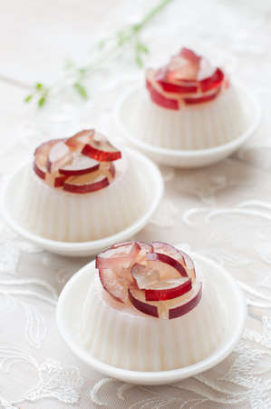 Dessert panna cotta with fresh grape on wooden background, selective focusの写真素材