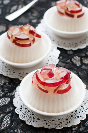 Dessert panna cotta with fresh grape on wooden background, selective focusの写真素材