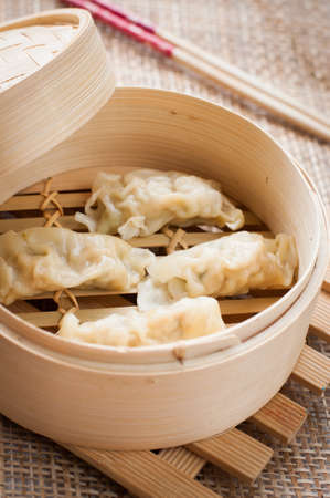 chinese dumplings on bamboo steamerの写真素材