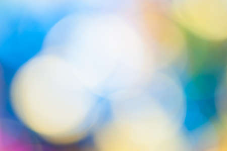 Red,orange and blue holiday bokeh. Abstract Christmas backgroundの写真素材