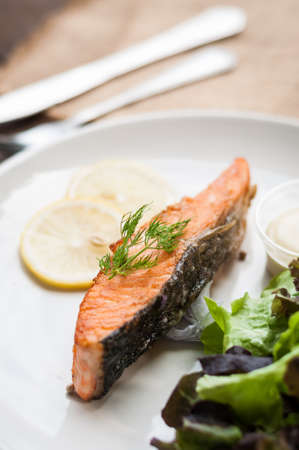 Salmon steak grilled with lemon