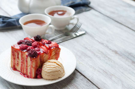 sweet toasts with raspberry, jam and a cup of teaの写真素材