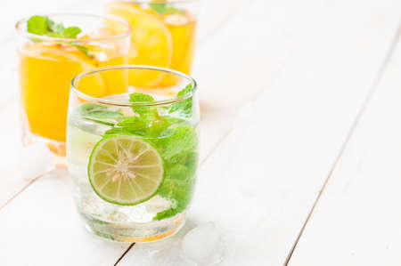 coctail of Mojito and tropical fresh juices on wooden tableの写真素材