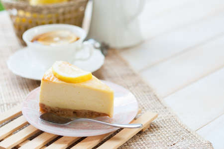 A slice of lemon cheesecake.の写真素材