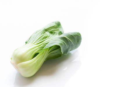 Bok choy (chinese cabbage) isolated on whiteの写真素材