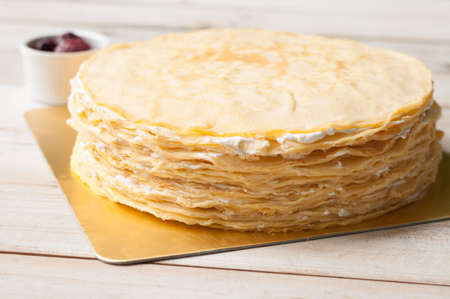 Crepe cake with blackberry sauce