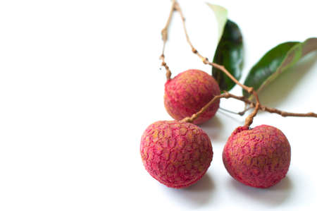 lychee berries on white dishの写真素材
