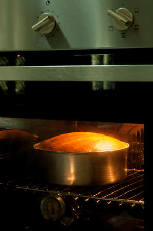 Baking cupcakes in the ovenの写真素材