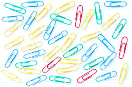 colorful paper clips isolated on white backgroundの写真素材