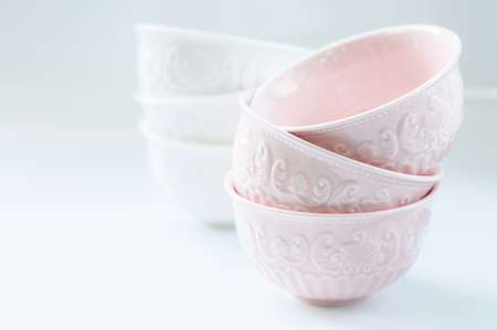 ceramic bowls stacked on whiteの写真素材