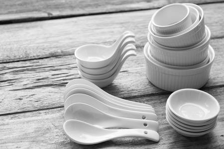 ceramic kitchenware on wooden board in black and white toneの写真素材