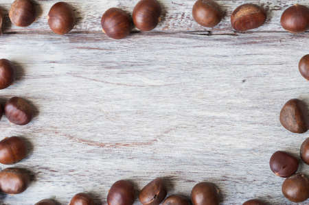 Chestnut on wooden backgroundの写真素材