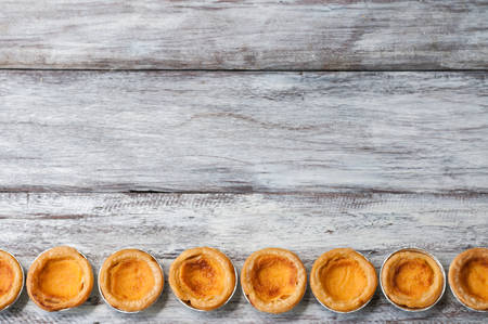 portuguese egg tart on wooden boardの写真素材