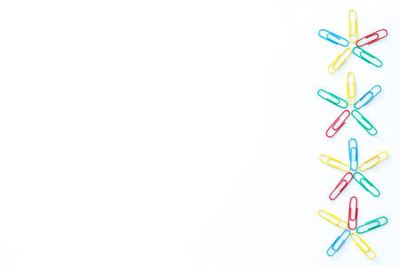 colorful paper clips isolated on white backgroundの写真素材