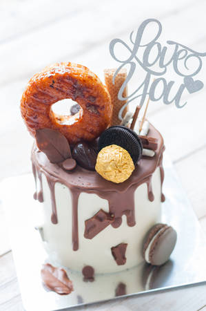 Chocolate Dipped cake with macaroon and donut with