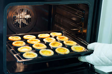 portuguese egg tart in ovenの写真素材