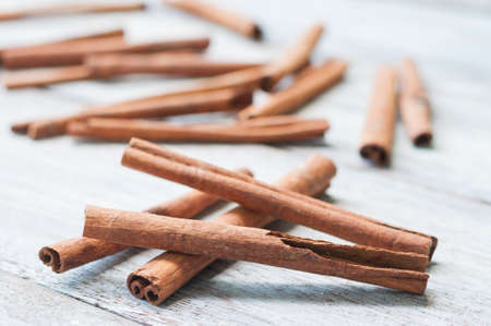cinnamon stick on wooden backgroundの写真素材