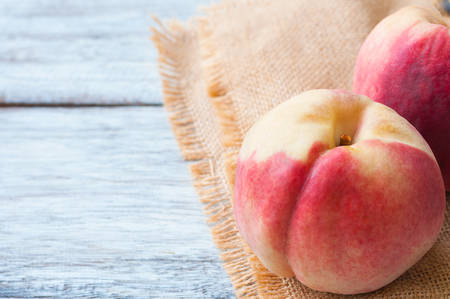 Fresh peaches on wooden backgroundの写真素材