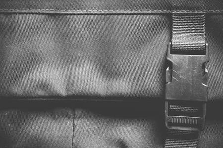 Black laptop bag with locker backgroundの写真素材