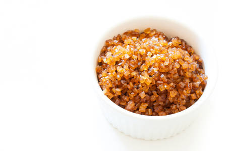 crystal caramel sugar in ramekin isolated on white backgroundの写真素材